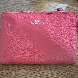Tangerine color coach wristlet